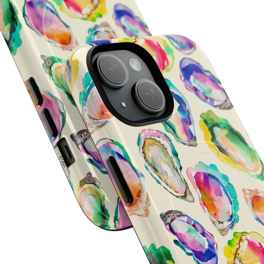 Colorful watercolor geode tough magnetic phone case featuring vibrant jewel-toned agate slices with flowing watercolor edges in blues, purples, pinks, and golds. Dual-layer protective design with rigid polycarbonate shell and flexible TPU liner. MagSafe compatible with embedded magnets for wireless charging. High-density 3D wrap print in glossy or matte finish. Perfect gift for crystal lovers and beach enthusiasts.