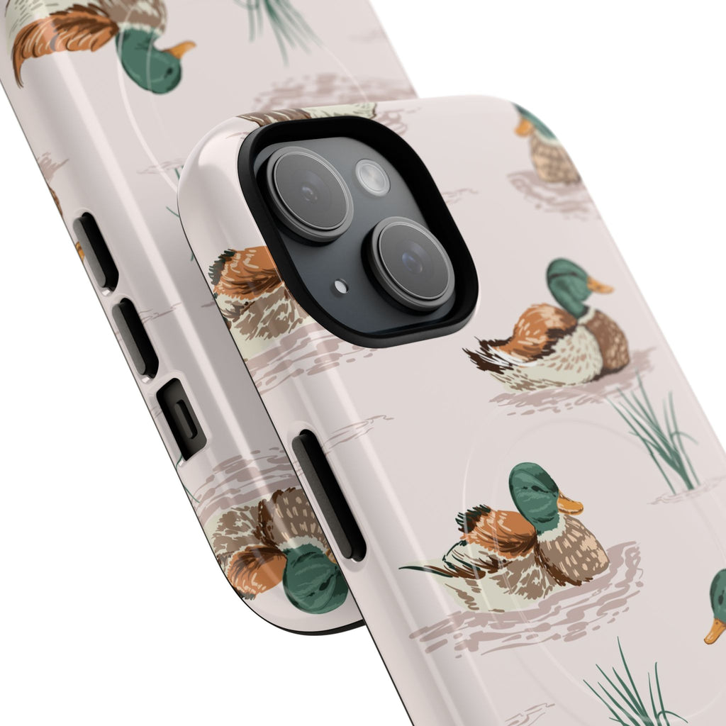 Artistic watercolor mallard duck phone case with dual-layer polycarbonate shell and TPU silicone liner, hand-painted ducks and reeds on soft warm background, MagSafe compatible wireless charging, nature-inspired protective cover in glossy or matte finish for iPhone
